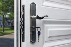 Opened door of a family home. Close-up of the lock with your keys on an armored front door. Security.